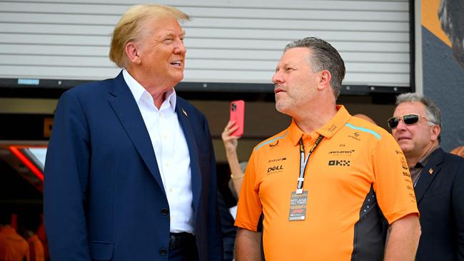 Donald Trump and McLaren Chief Executive Officer Zak Brown talk in the pitlane. Photo: Clive Mason/Getty Images/AFP.