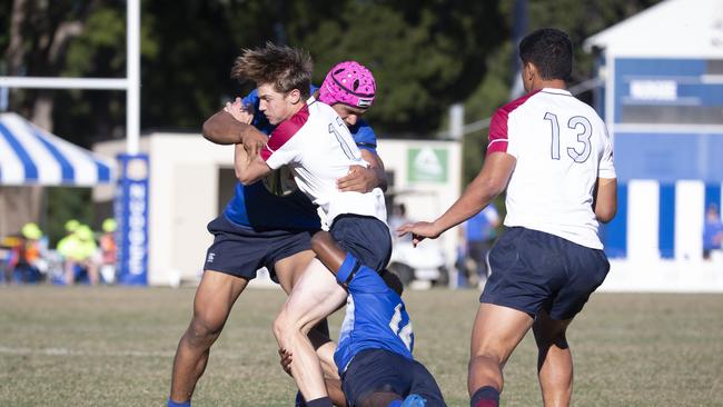 Rixon Aliva is tackled by Nudgee Lastus Auakai and Robert Toia. Picture: Renae Droop