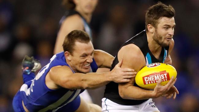 Drew Petrie tackles Port Adelaide’s Sam Gray. Picture: Getty Images