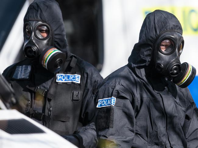 Police officers in protective suits and masks work near the scene where former double-agent Sergei Skripal and his daughter, Yulia were poisoned. Picture: Jack Taylor/Getty Images