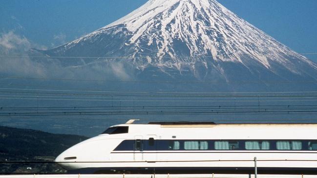 Undated : Bullet train railway in front of Mount (Mt) Fuji, Japan.