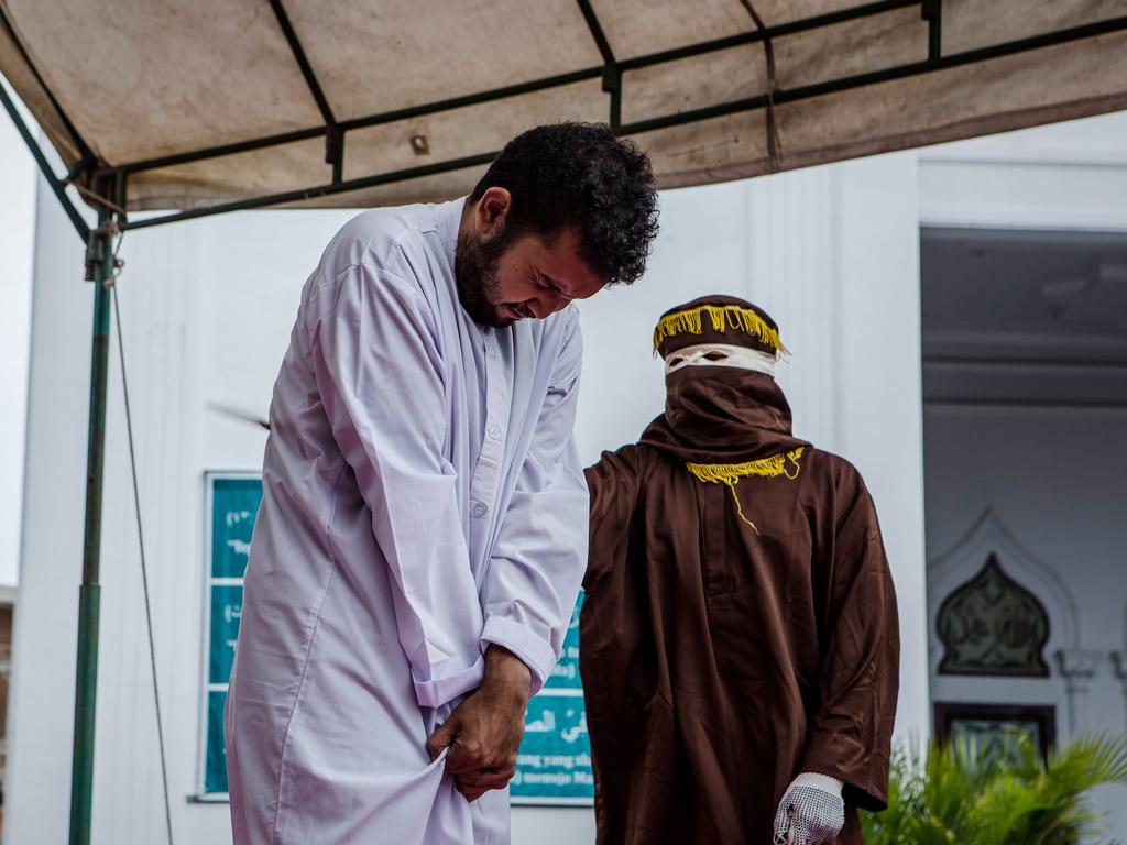 An Indonesian man gets caning in public for having gay sex, which is against Sharia law in Banda Aceh, Indonesia. Picture: Ulet Ifansasti/Getty Images