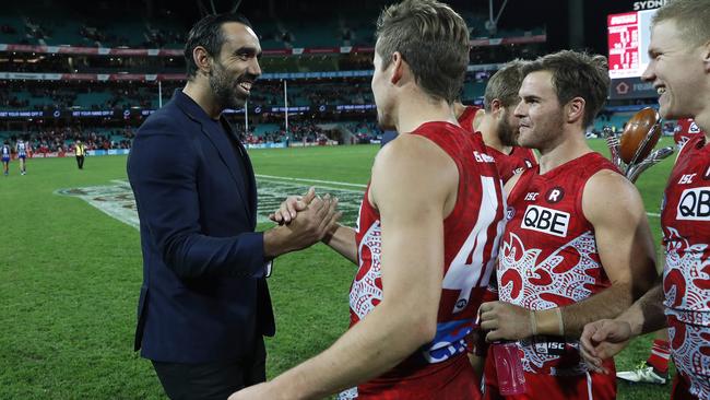 Adam Goodes celebrates with Sydney players after the Swans beat North Melbourne. Picture: Phil Hillyard