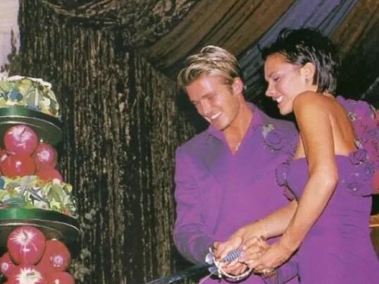 The couple wore purple matching outfits at their 1999 wedding reception.