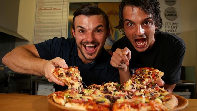 Scott Jelich and brother Daniel Jelich of Merlins Pizza with Excallibur, one of their signature pizzas. Gold Coast. Photo: Regi Varghese