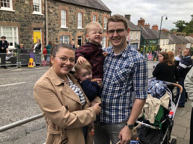 Hannah Buchanan, 25, holding Edward, eight months, and her husband Philip, 28, holding Levi. They were waiting for King Charles to arrive at Hillsborough Castle outside Belfast on Tuesday September 13. Picture: Stephen Drill