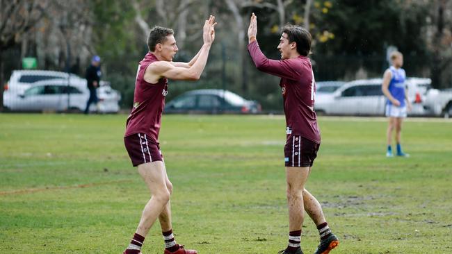 PAOC’s Jake Pitt and Tom Fisher celebrate a goal. Results from our poll say footy fans believe 2019 will be the year of the Old Reds. Picture: AAP/Morgan Sette