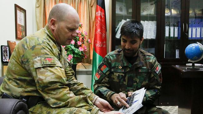 Australian Army Warrant Office Class One Brian Buskell and Afghan Army Sergeant Major Hamdard meet at the Afghan National Army Sergeant Major Academy.