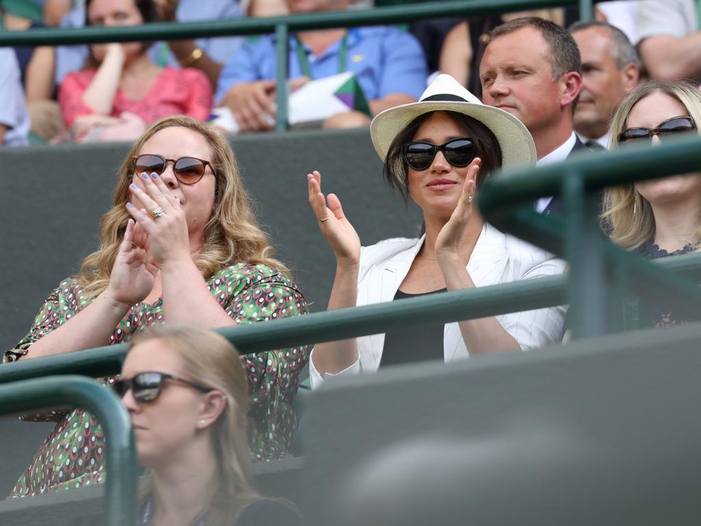 Megan Markle applauds the action between points. Picture: Ella Pellegrini