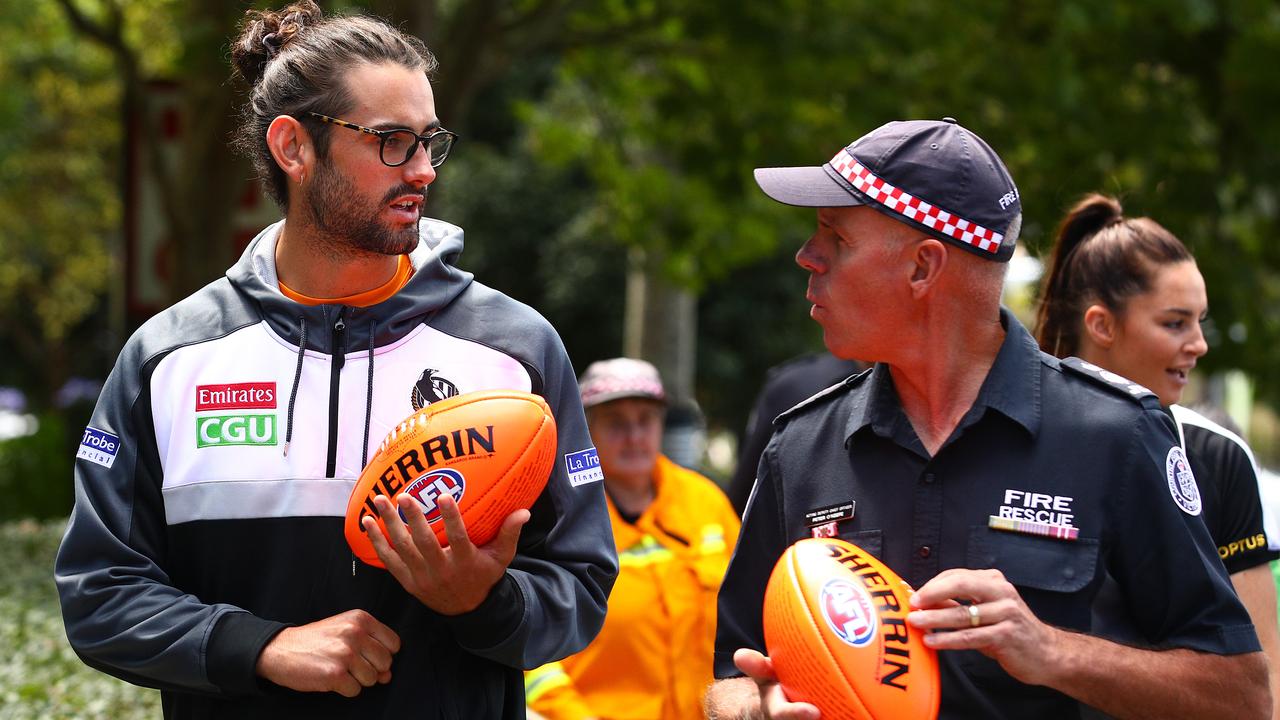 Grundy chats with a member of the CFA. Picture: Getty Images