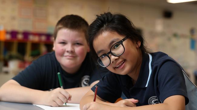 Thanks to the help of students Will and Anh-Thu, Footscray High School will have one of the coolest uniforms on the block. Picture: Mark Dadswell