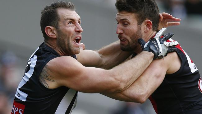 Magpie Travis Cloke locked in battle with Bomber Cale Hooker. Picture: Michael Klein