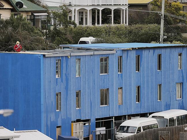 Work finally resumes on South Hobart's infamous 'blue house', the unfinished blue apartment block on Lynton Avenue. Picture: MATHEW FARRELL