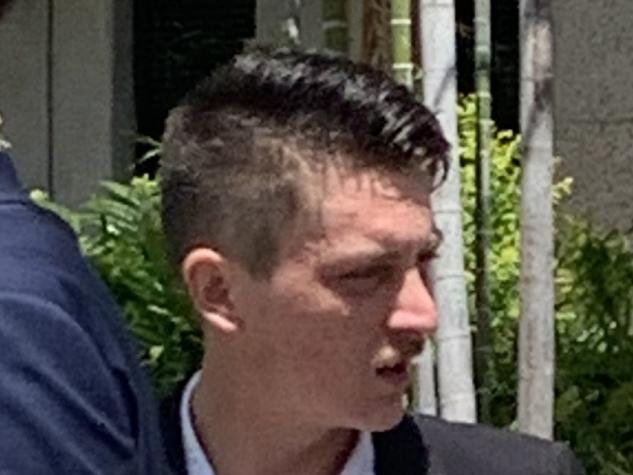 Koby Lee Dance-Watson was sentenced to two and a half years' jail with immediate parole for trafficking in dangerous drugs. (Man on right hand side wearing black suit, white shirt, no tie, black shoes looking to the side.)