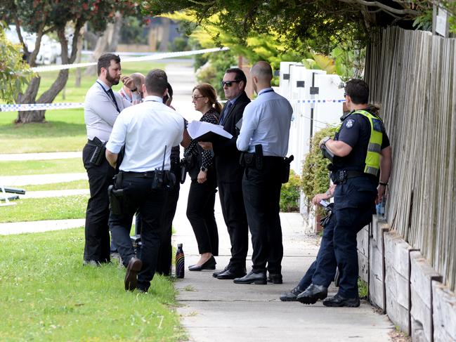 Detectives at the scene where the pair was found dead. Picture: Andrew Henshaw