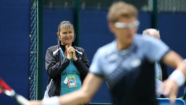 Mother and coach of Denis Istomin of Uzbekistan, Klaudiya Istomin, looks on during a practice session.