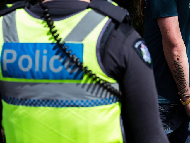 MELBOURNE, AUSTRALIA - SEPTEMBER 19: A man is detained by members of Victoria Police on Marine Parade in Brighton on September 19, 2020 in Melbourne, Australia. Anti-lockdown protesters have been using encrypted messaging to organise "freedom day" rallies to avoid police learning the location of their anti-lockdown protests.  Metropolitan Melbourne remains under stage 4 lockdown restrictions, with people only allowed to leave home to give or receive care, shopping for food and essential items, daily exercise and work while an overnight curfew from 8pm to 5am is also in place. The majority of retail businesses are also closed. Other Victorian regions are in stage 3 lockdown. The restrictions, which came into effect from 2 August, were introduced by the Victorian government as health authorities work to reduce community COVID-19 transmissions across the state. (Photo by Darrian Traynor/Getty Images)