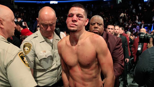 Nate Diaz leaves the Octagon after his majority-decision loss to Conor McGregor.