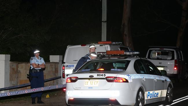 Police and Forensic Services have established a crime scene on Porters Road, Kenthurst after three people were struck with pellets from a shotgun blast. Three men arrived at the property in a black BMW and wearing balaclavas, they fled the scene soon after the shot was fired. Pics Bill Hearne