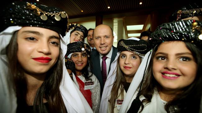 Immigration Minister Peter Dutton with Yazidi refugees at a Refugee Week event at Parliament House yesterday. Picture: Kym Smith