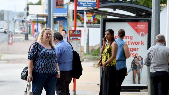 Standed commuters wait for alternative transport under the South Rd overpass. Photo Sam Wundke