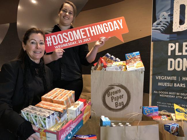 St Marys Rugby League Club marketing co-ordinators Yvette Haines and Madelaine Caruana with items donated as part of the Brown Paper Bag project.