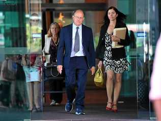 Dr William Russell Massingham Pridgeon (centre)  leaving the Brisbane Magistrates Court in Brisbane, Friday, April 5. Dr Pridgeon is is facing charges for his alleged role in an abduction ring network that helped mothers kidnap their children. Picture: DARREN ENGLAND