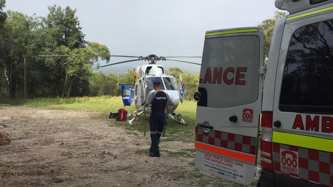 The CareFlight helicopter and an ambulance at West Head. Photo CareFlight