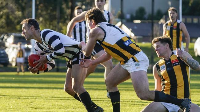 Narre Warren’s Brad Scalzo with the ball. Picture: Valeriu Campan