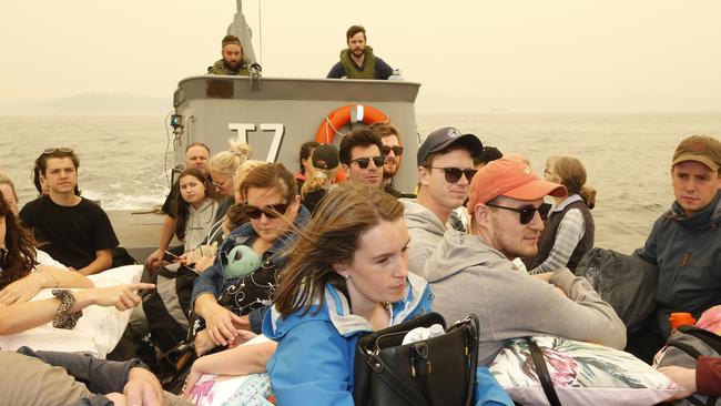 Evacuees ship out of Mallacoota after being trapped for days. Picture: David Caird