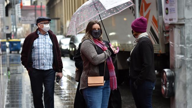 People in Melbourne wearing masks. Picture: Nicki Connolly