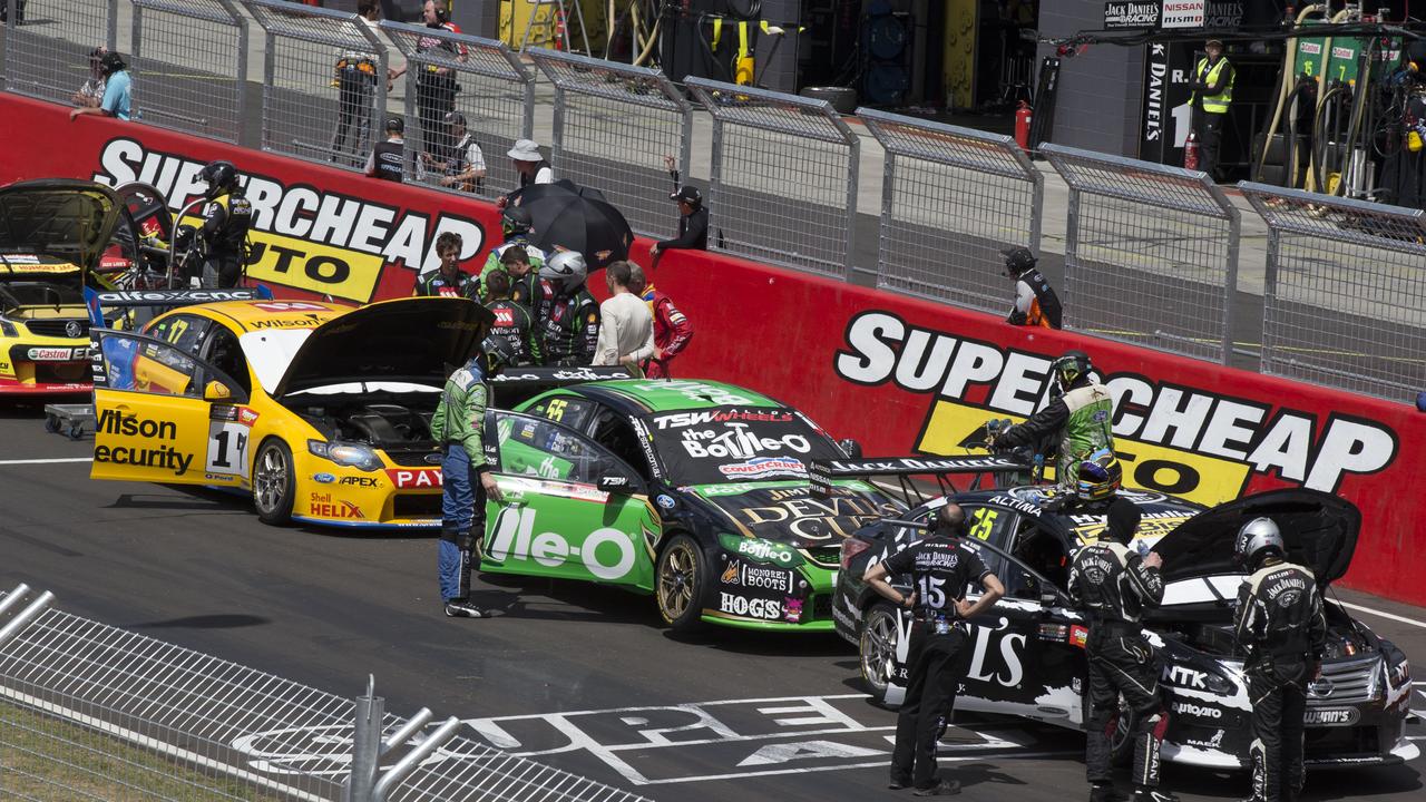 Cars sit on the grid after the 2014 Bathurst 1000 was red-flagged for an hour for track repairs.