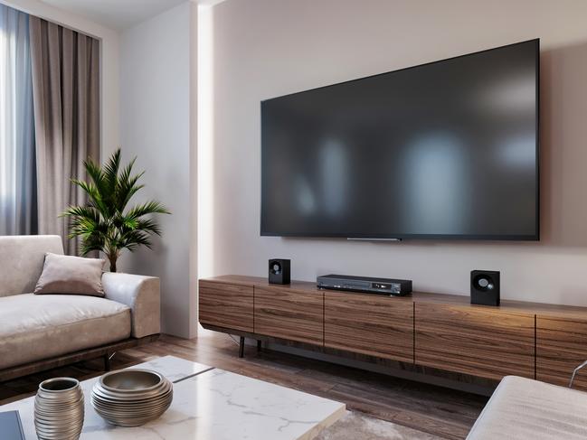 Modern apartment living room interior with large TV screen on the wall. render