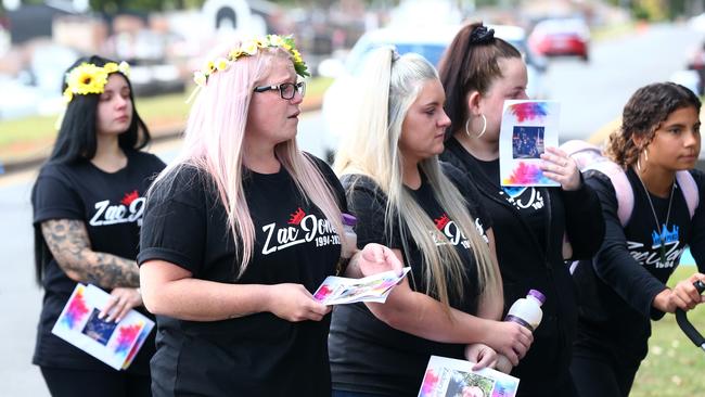 Mourners wore sunflowers in their hair at the funeral of Zachary Jones at Mt Gravatt Crematorium Chapel. PHOTO: Adam Head