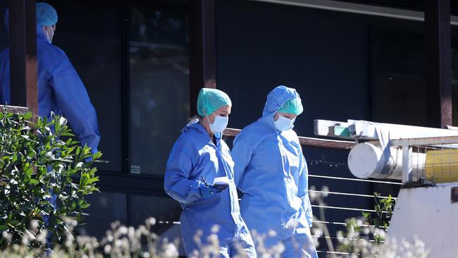 Forensic officers at the crime scene. Picture: Nigel Hallett