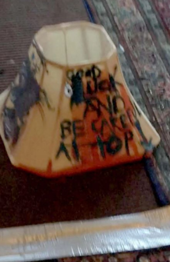 A lamp scrawled with writing and blood. Photo: Fairfax County