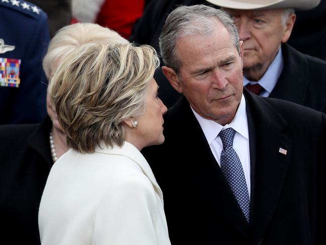 Former Democratic presidential nominee Hillary Clinton whispers to former President George W. Bush on the West Front of the U.S. Capitol on January 20, 2017 in Washington, DC. In today’s inauguration ceremony Donald J. Trump becomes the 45th president of the United States. Picture: Getty