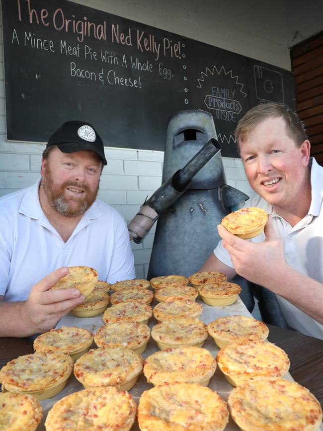 Owners Adam and Brett Ohara with the famous Ned Kelly pies - a traditional mince pie topped with bacon, a whole egg and cheese. Picture: Dean Martin