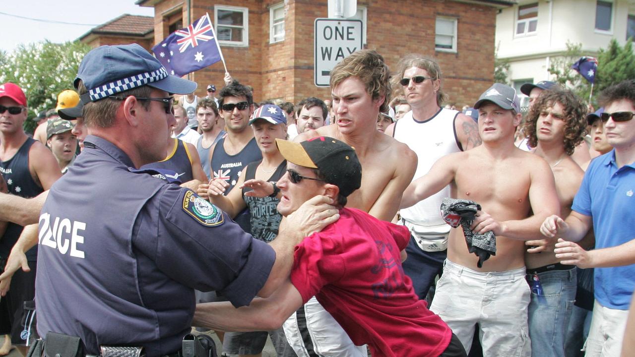 Police struggle to control rioters in 2005 as they roam the streets searching for anyone of Lebanese origin for a revenge attack.