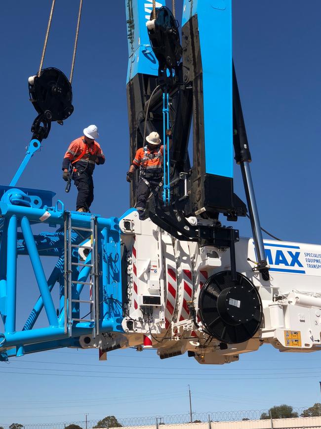 Employees at work on the new 1200t crane. Picture: Supplied