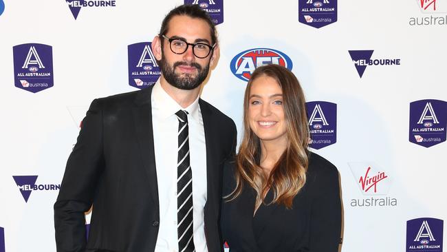 Brodie Grundy with in partner Rachael in 2019