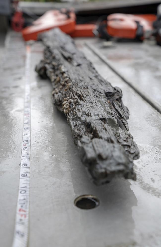 Archaeologists examine a loose piece of the wrecked Gulf schooner Clotilda, in delta waters north of Mobile Bay, Alabama. Picture: AP