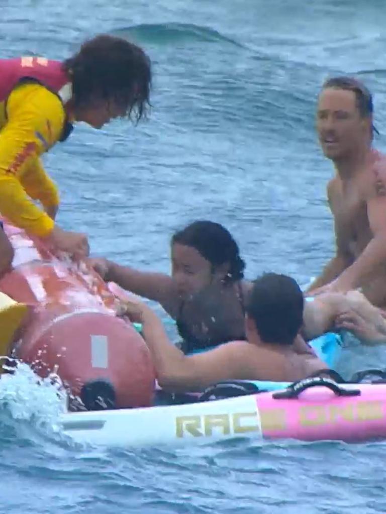 Swimmers helped onto IRBs during the rescue