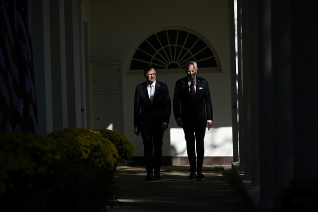 US President Joe Biden and Australia's Prime Minister Anthony Albanese walk along the colonnade of the White House