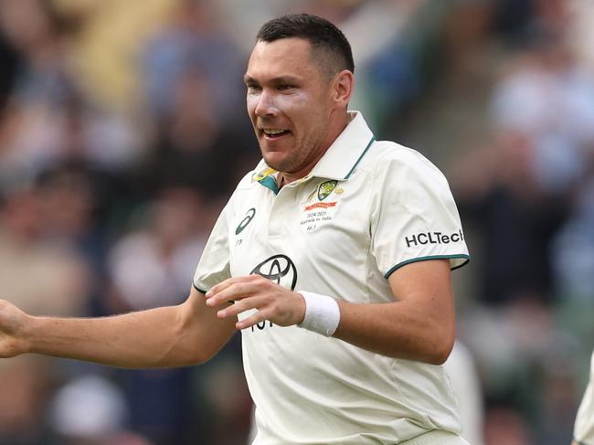 MELBOURNE, AUSTRALIA - DECEMBER 27: Scott Boland of Australia celebrates the wicket of Virat Kohli of India during day two of the Men's Fourth Test Match in the series between Australia and India at Melbourne Cricket Ground on December 27, 2024 in Melbourne, Australia. (Photo by Robert Cianflone/Getty Images)