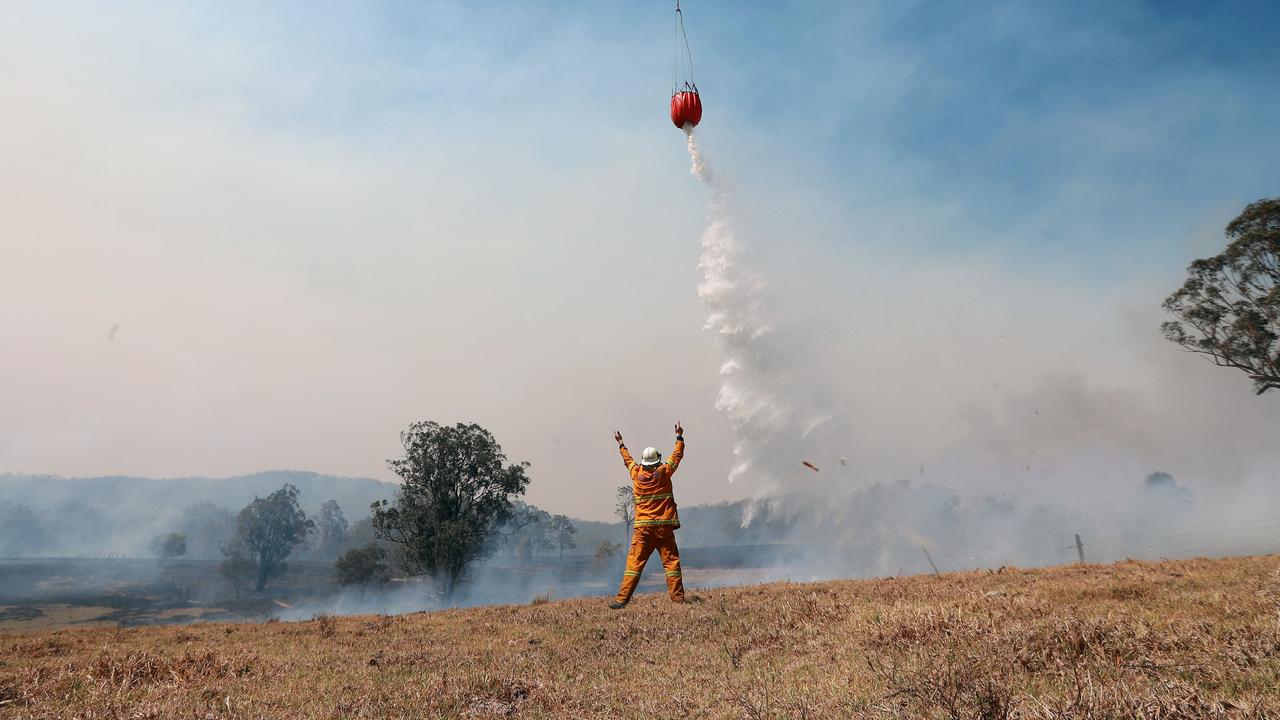 Welcome water bombers protecting a property. Picture: Gary Ramage