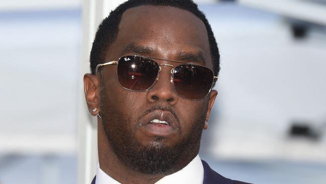 (FILES) Sean "Diddy" Combs attends the star ceremony for Mary J. Blige, on the Hollywood Walk of Fame, January 11, 2018 in Hollywood, California. More sexual assault claims have been filed against Sean Combs in New York, after the rap mogul known as "Diddy" and R&B singer Cassie settled a suit alleging physical abuse and rape last week. A lawsuit filed November 23 by Joi Dickerson-Neal alleged she had been "drugged, sexually assaulted and abused" in 1992 by the rapper, also known as "Puff Daddy," and that he had filmed and distributed the acts as "revenge porn." The suits have been submitted under the New York Adult Survivors Act, a law that opened a one-year window for sexual assault claims to be filed that otherwise happened too far in the past to litigate. (Photo by Robyn Beck / AFP)