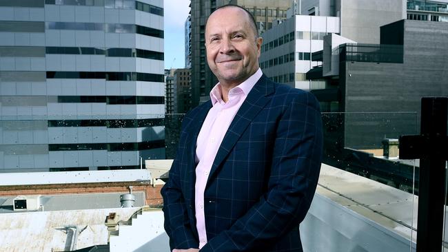 Paul Anderson, CEO of Mellor Olsson, on the balcony of the law firm’s new home at the former Peoples Palace on Pirie Street. Picture Mark Brake