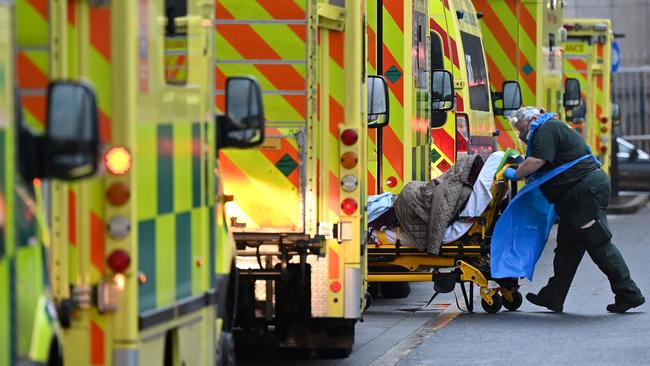 A paramedic is seen by a line of ambulances outside the Royal London Hospital in east London on January 5, 2021. Picture: JUSTIN TALLIS / AFP