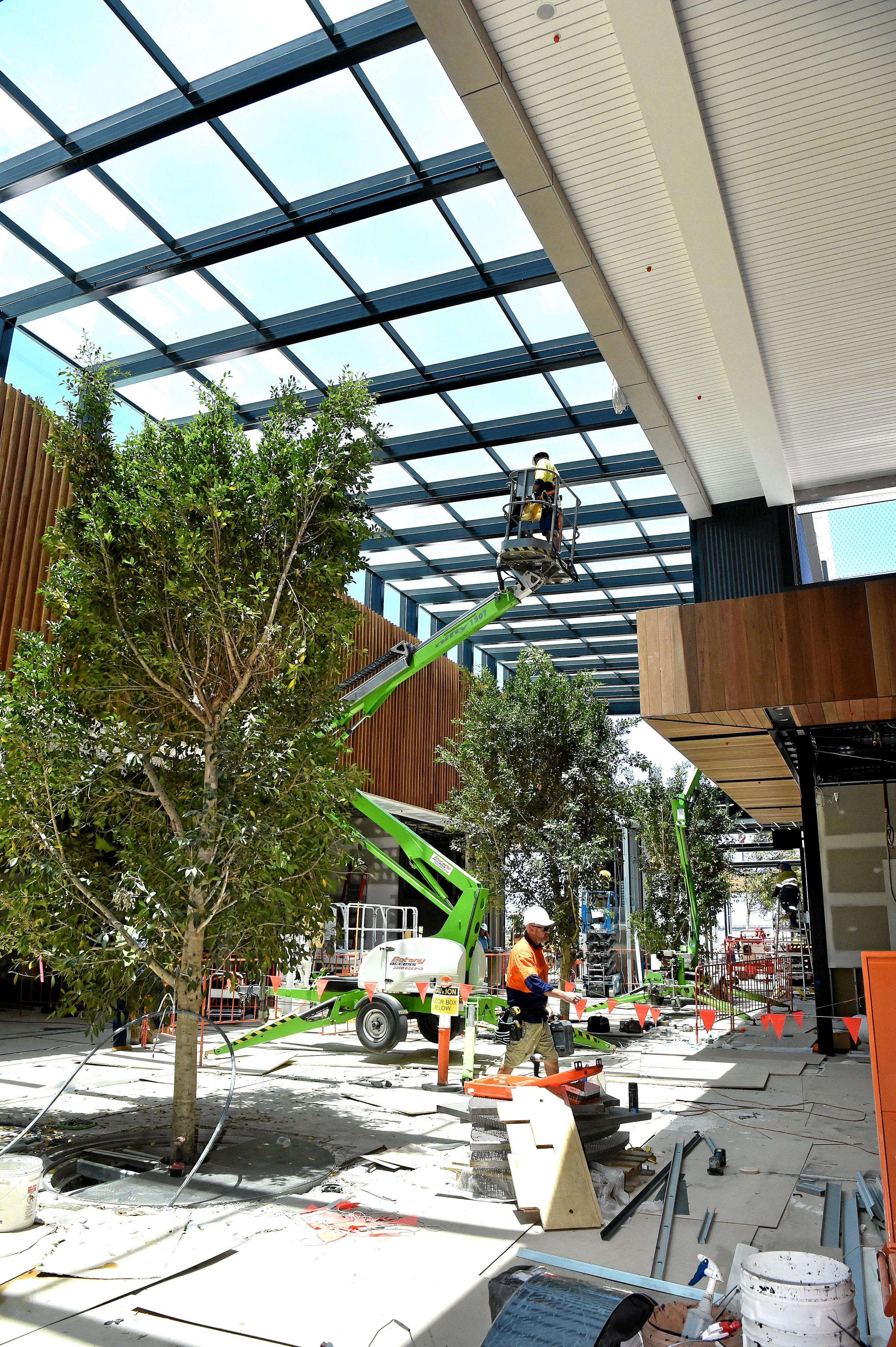 Full steam ahead for the opening of the Stockland Birtinya Shopping Centre. Constuction workers put the final pieces together for the grand opening in a couple of weeks. Picture: Warren Lynam